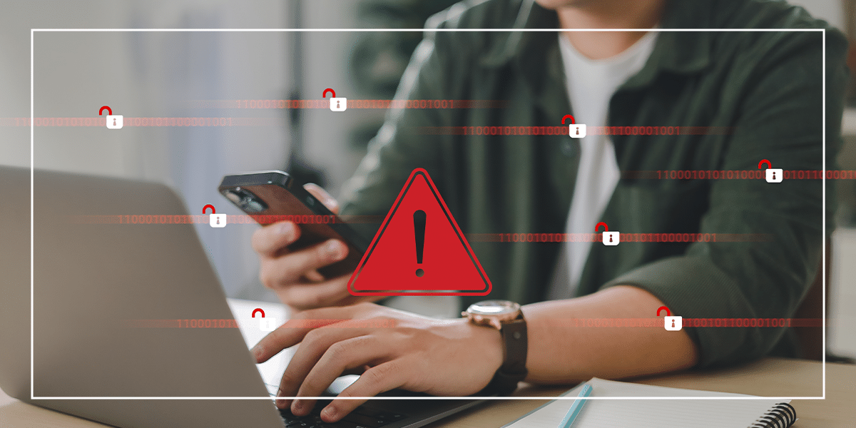 pessoa-mexendo-no-computador-com-simbolo-de-perigo
